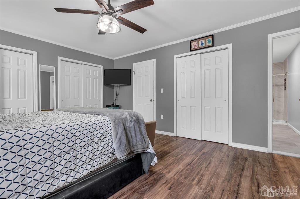 21 Bramble Lane Old Bridge, NJ 07747 - Photo 20 of 35 a bedroom with a bed and a chandelier