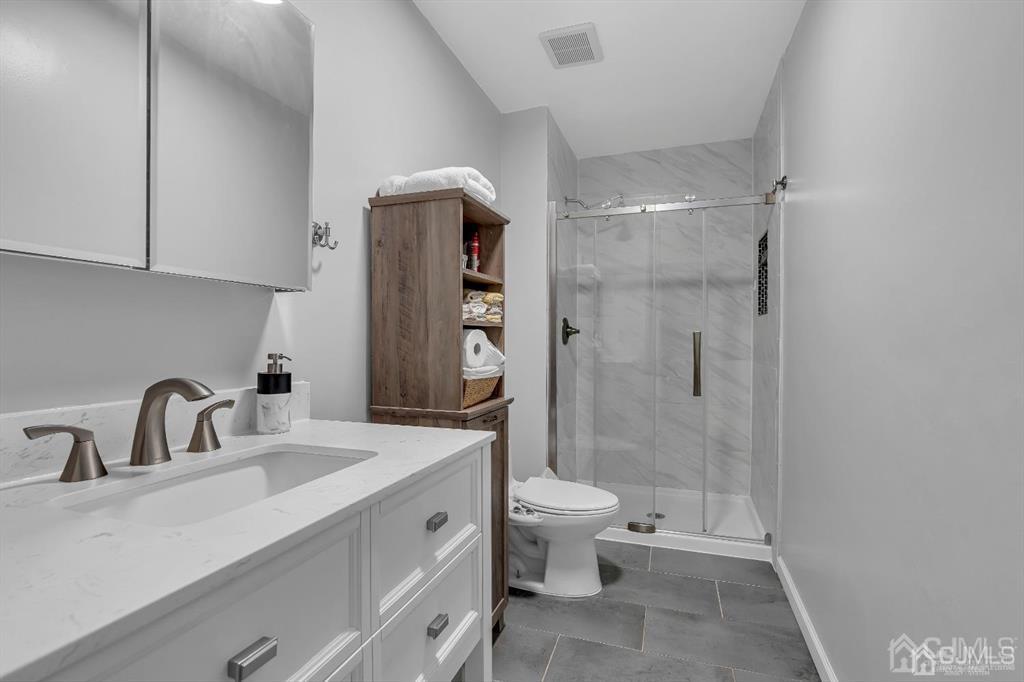 21 Bramble Lane Old Bridge, NJ 07747 - Photo 21 of 35 a bathroom with a double vanity sink toilet and shower
