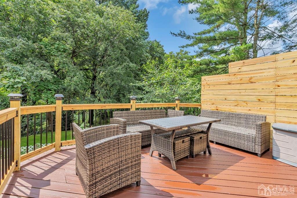 21 Bramble Lane Old Bridge, NJ 07747 - Photo 30 of 35 a balcony with wooden floor table and chairs