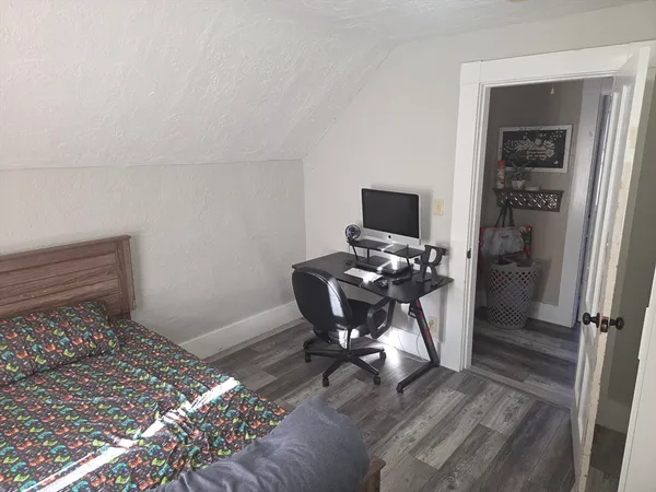 a workspace with furniture and a window