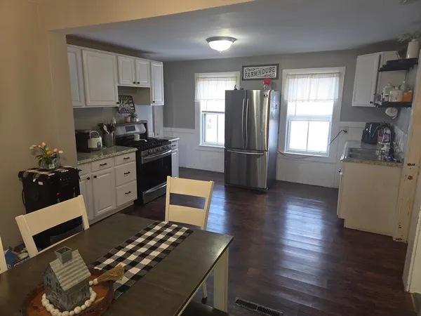 a kitchen with a sink stove and refrigerator