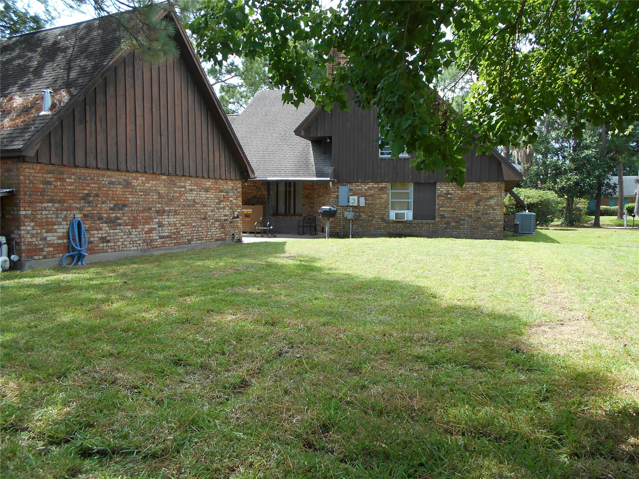 8600 Stonegate Court Port Arthur, TX 77642 - Photo 29 of 30 a view of a backyard with a small cabin