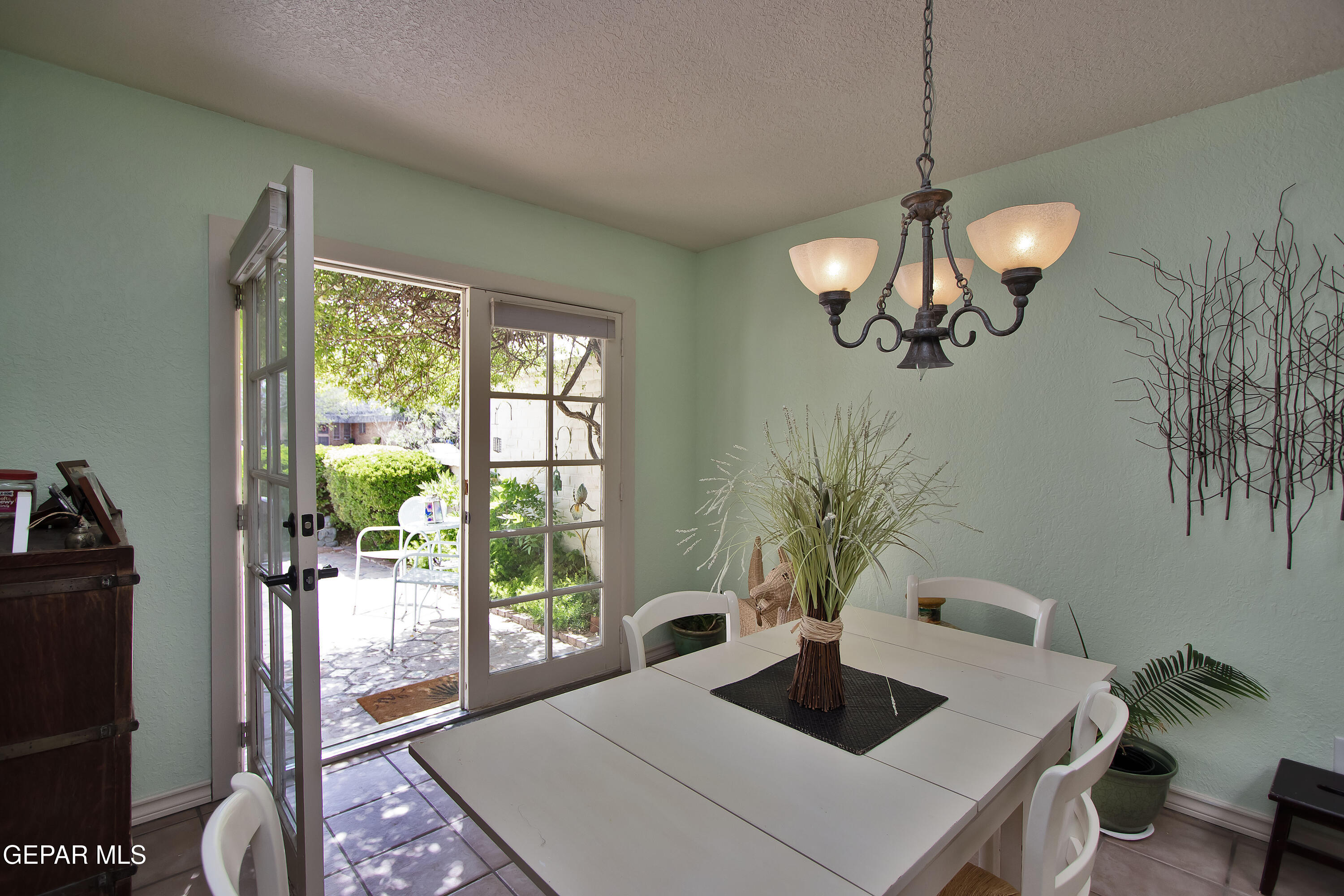 116 North Trevino Road Santa Teresa, NM 88008 - Photo 16 of 77 a view of a dining room with furniture wooden floor and chandelier