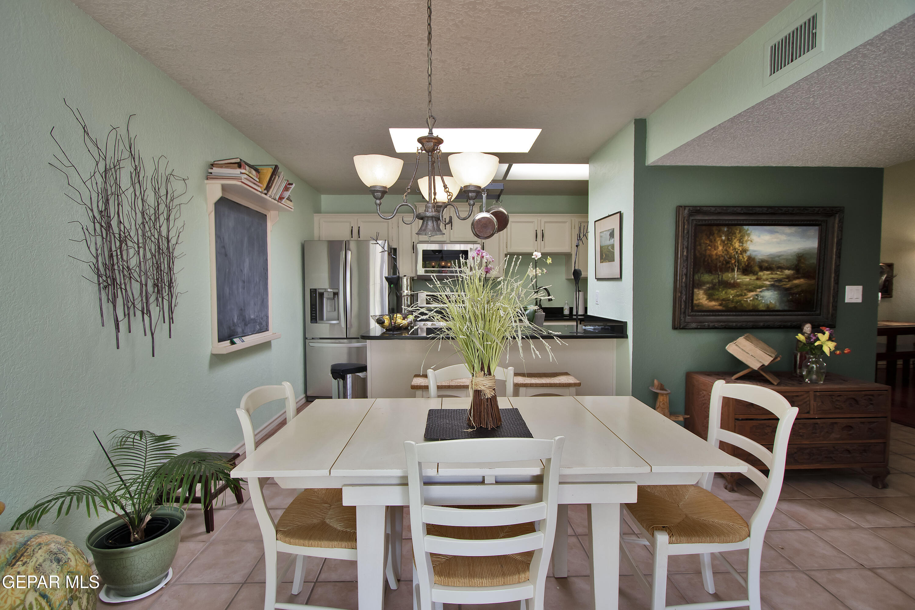 116 North Trevino Road Santa Teresa, NM 88008 - Photo 17 of 77 a view of a dining room with furniture and chandelier