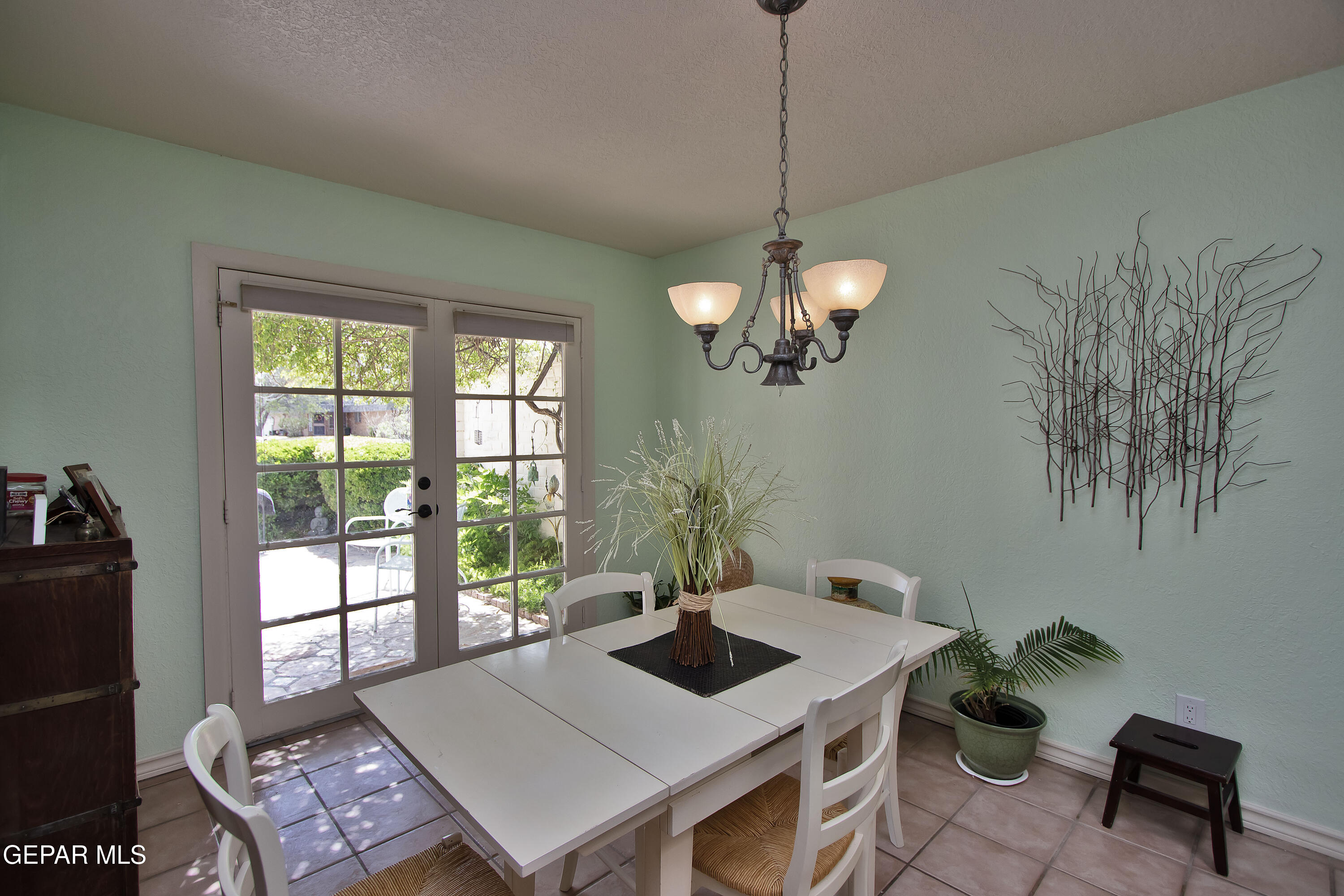 116 North Trevino Road Santa Teresa, NM 88008 - Photo 19 of 77 a view of a dining room and a table chairs and chandelier