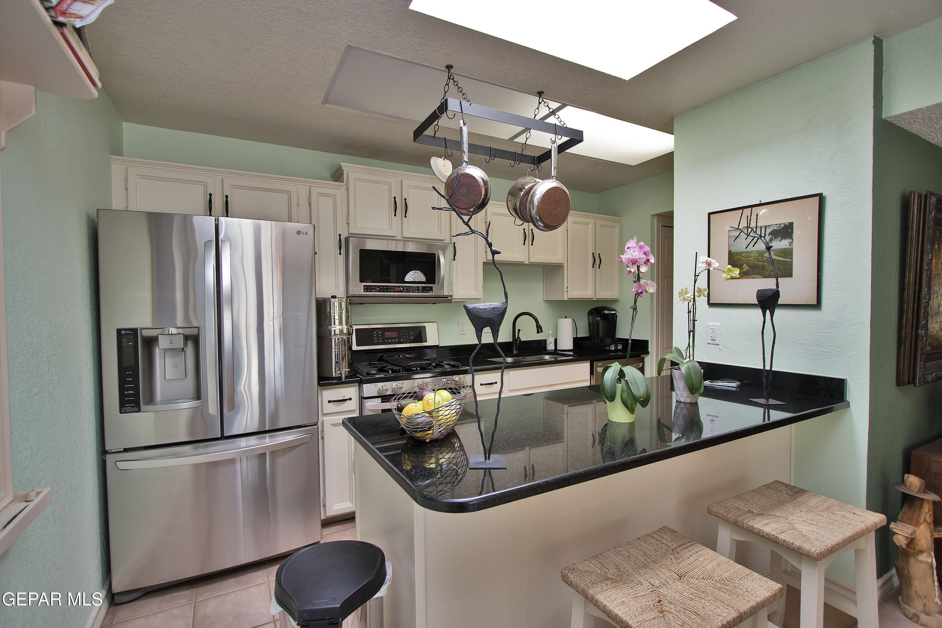 116 North Trevino Road Santa Teresa, NM 88008 - Photo 20 of 77 a kitchen with stainless steel appliances granite countertop a sink a stove and a refrigerator