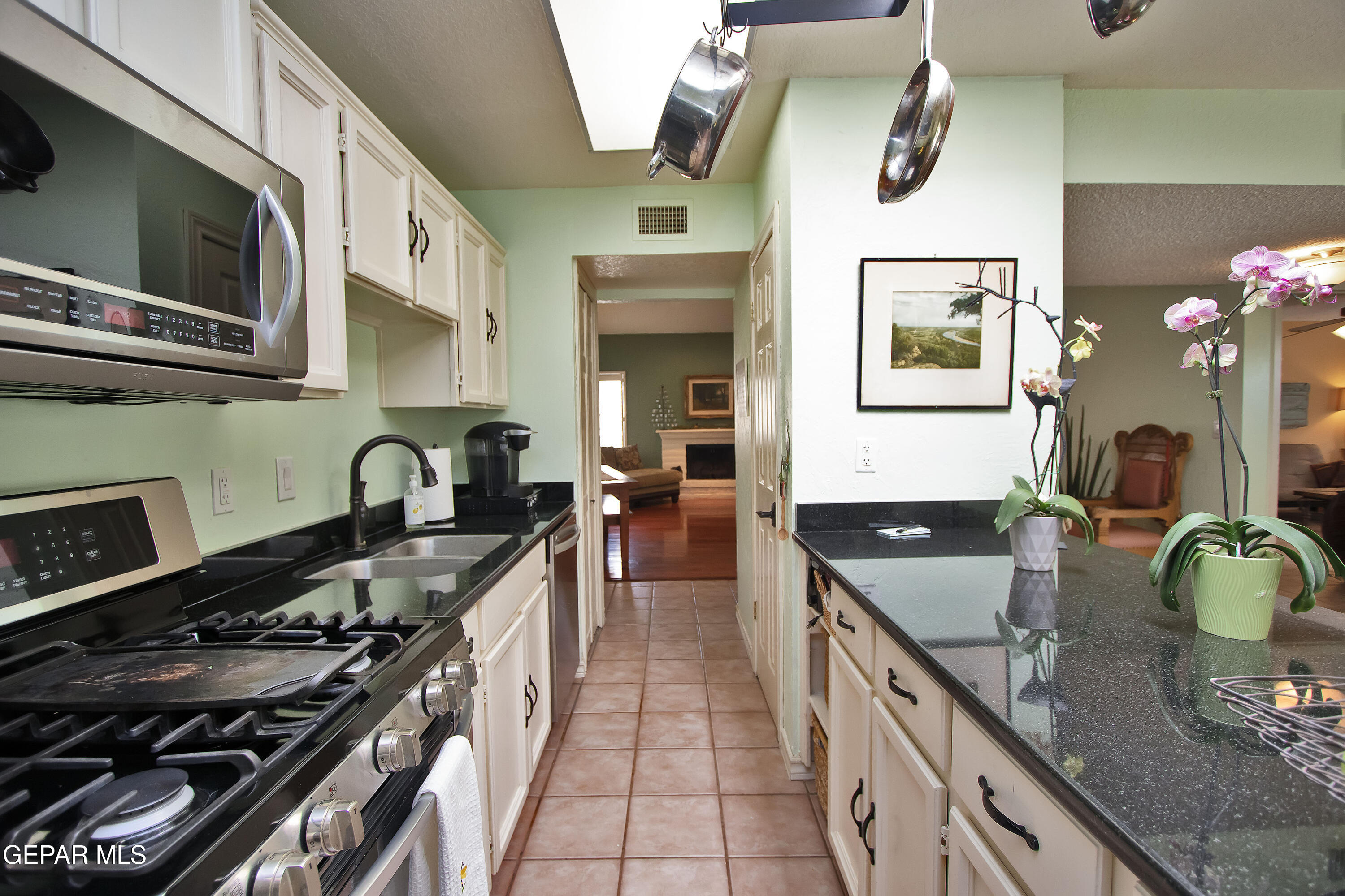 116 North Trevino Road Santa Teresa, NM 88008 - Photo 22 of 77 a kitchen with stainless steel appliances granite countertop a stove and a sink