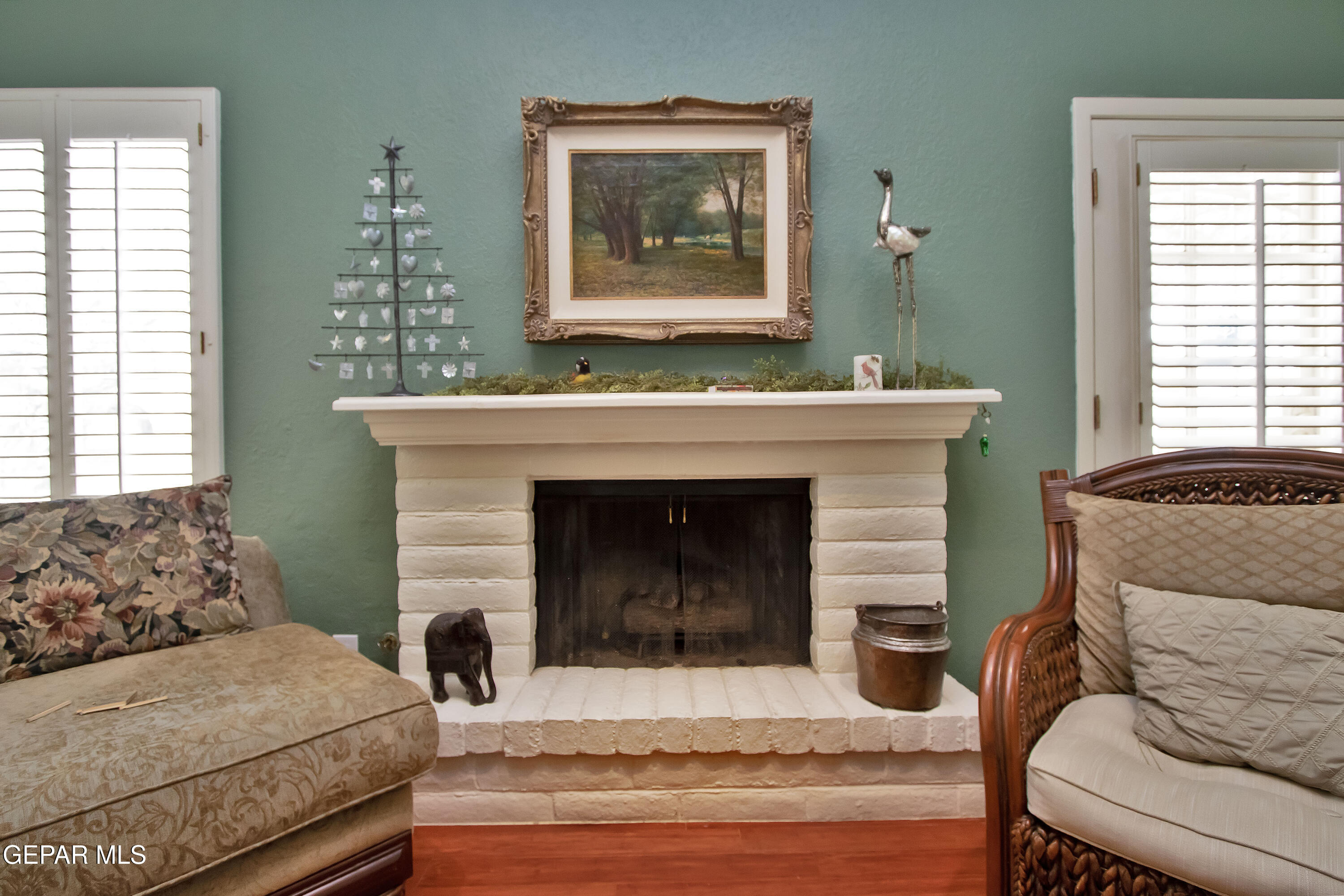 116 North Trevino Road Santa Teresa, NM 88008 - Photo 30 of 77 a bedroom with a bed and a fireplace