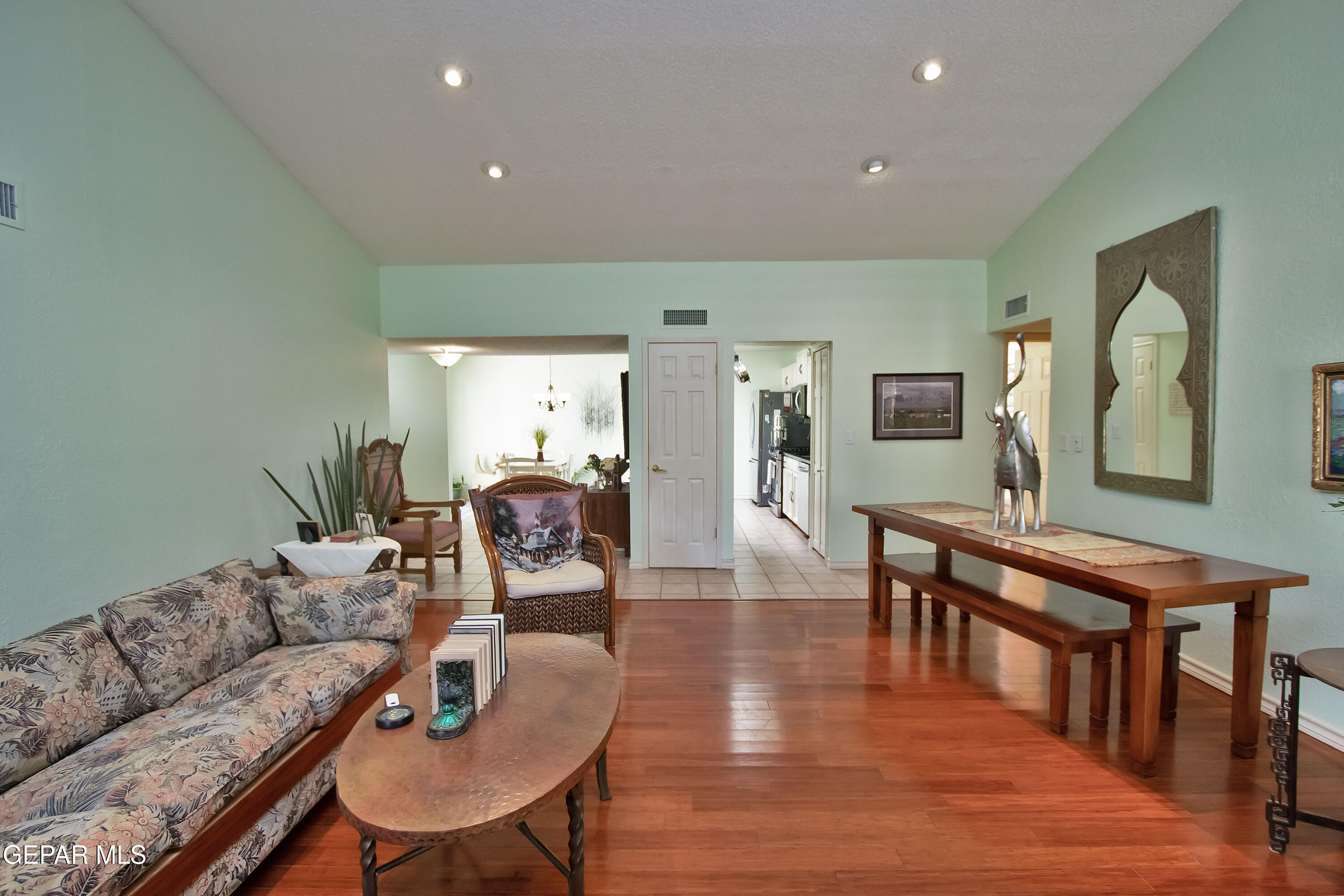 116 North Trevino Road Santa Teresa, NM 88008 - Photo 32 of 77 a living room with furniture kitchen view and a wooden floor