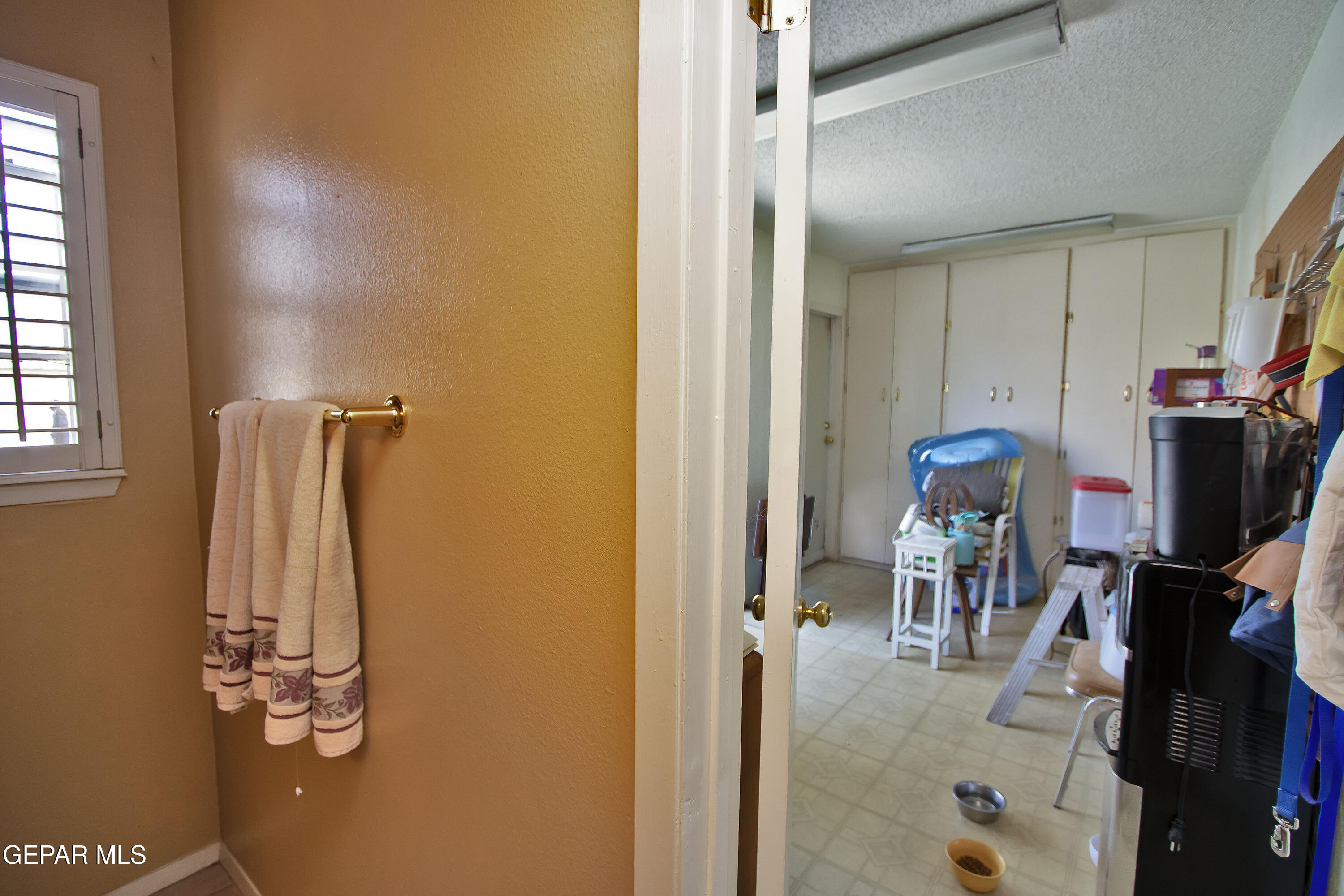 116 North Trevino Road Santa Teresa, NM 88008 - Photo 42 of 77 a view of walk in closet with clothes and shoes