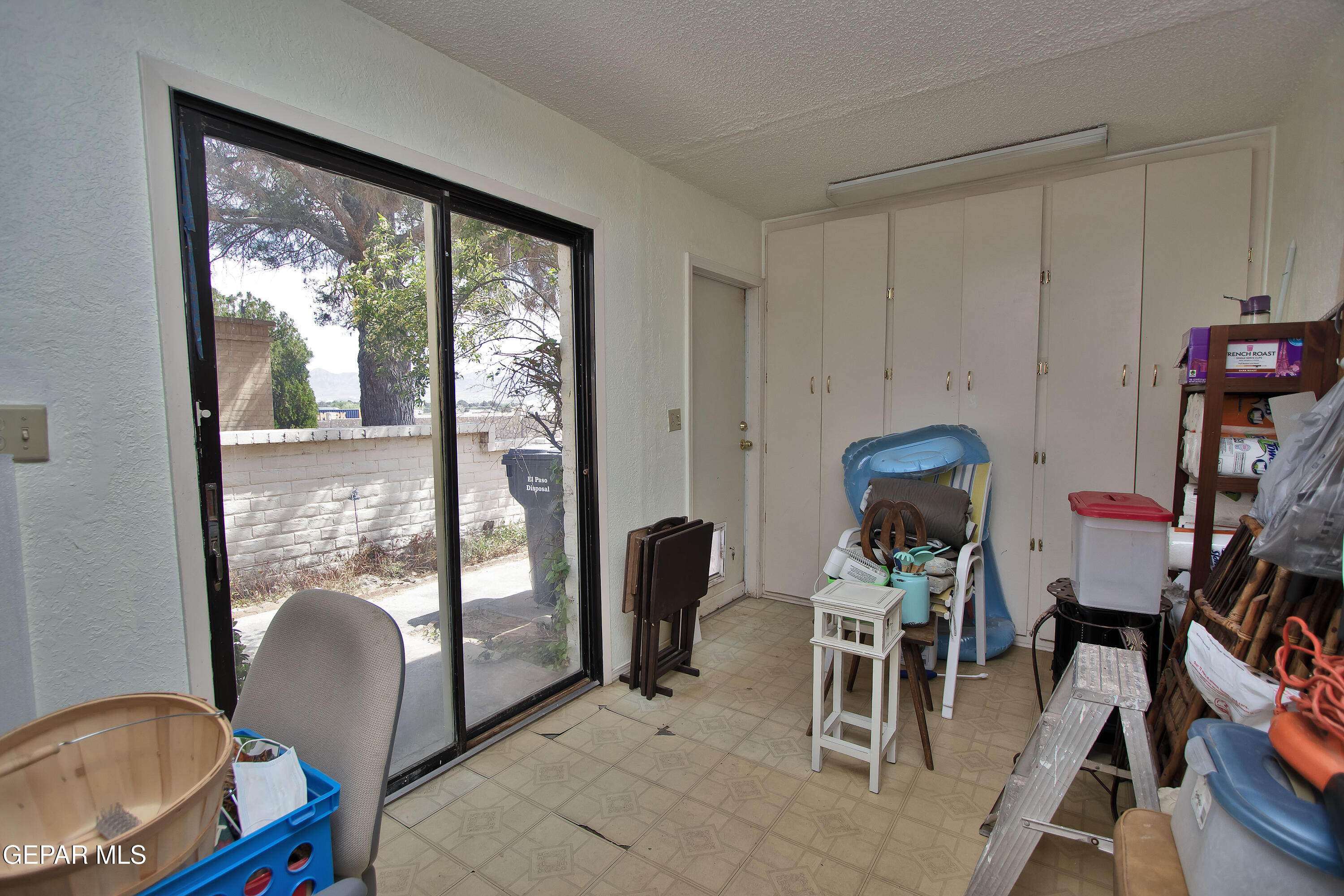 116 North Trevino Road Santa Teresa, NM 88008 - Photo 43 of 77 a workspace with furniture and a window