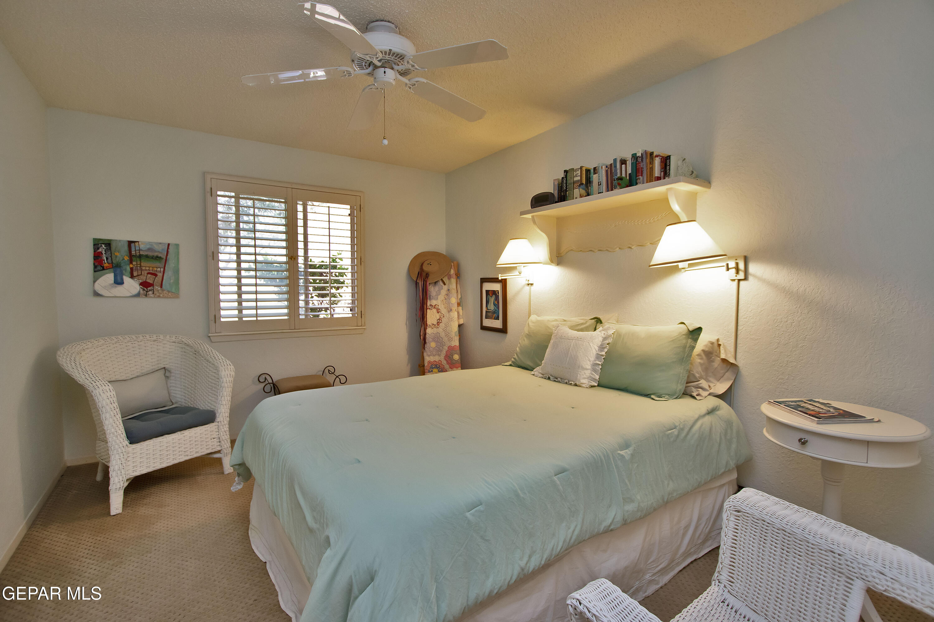 116 North Trevino Road Santa Teresa, NM 88008 - Photo 52 of 77 a bedroom with a bed and a chair