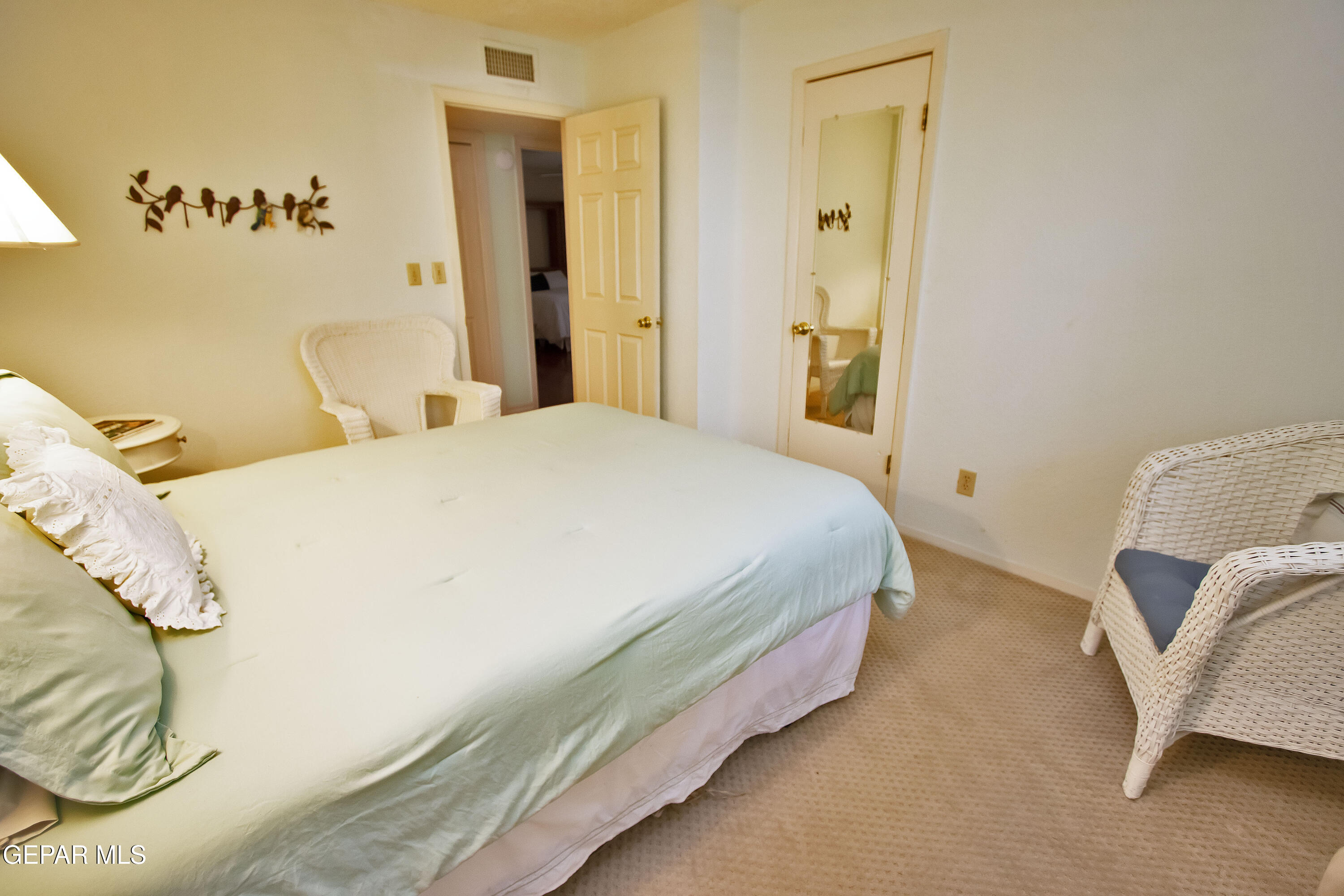 116 North Trevino Road Santa Teresa, NM 88008 - Photo 54 of 77 a bedroom with a bed and a couch