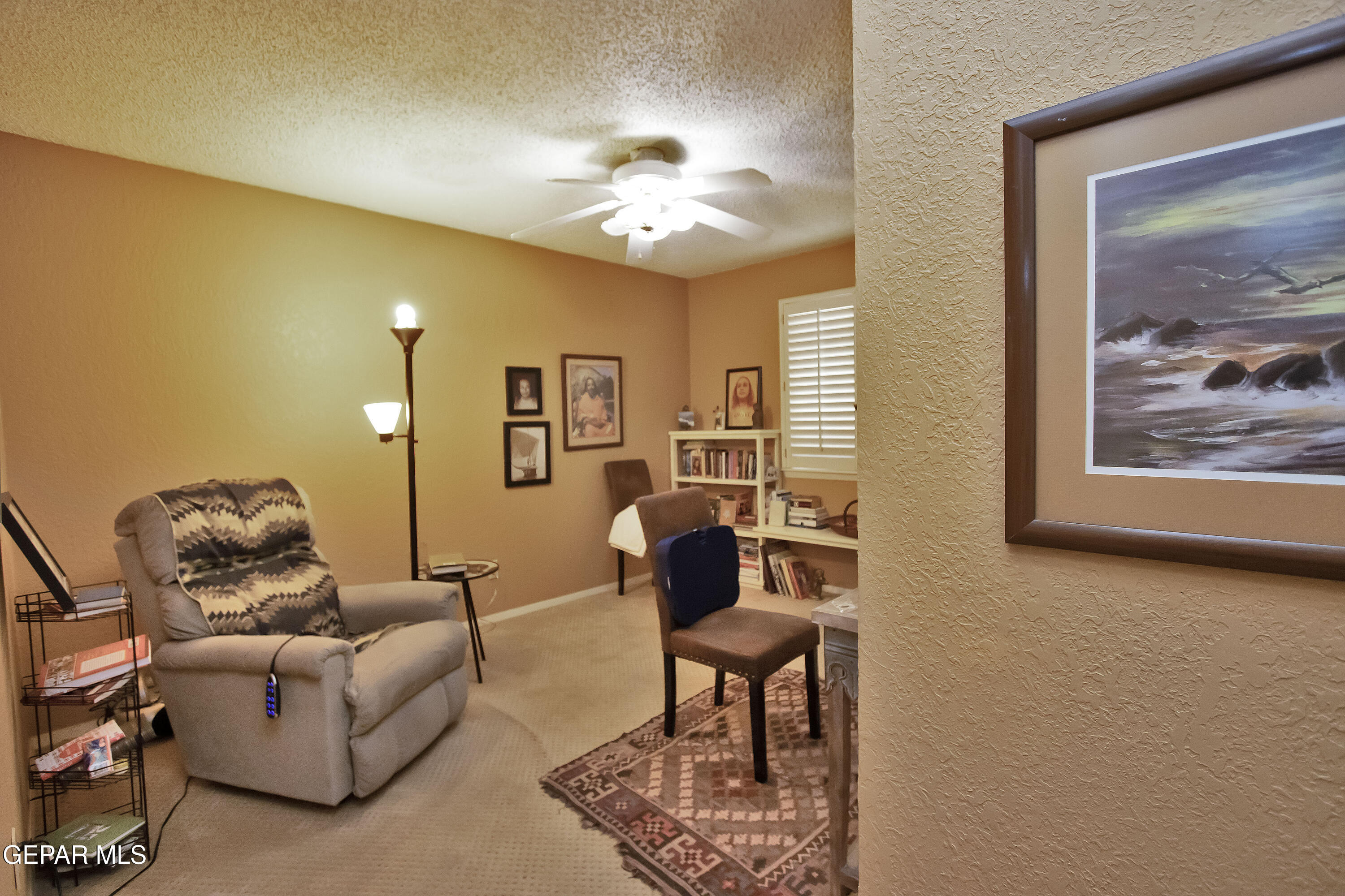 116 North Trevino Road Santa Teresa, NM 88008 - Photo 55 of 77 a living room with furniture and a chandelier