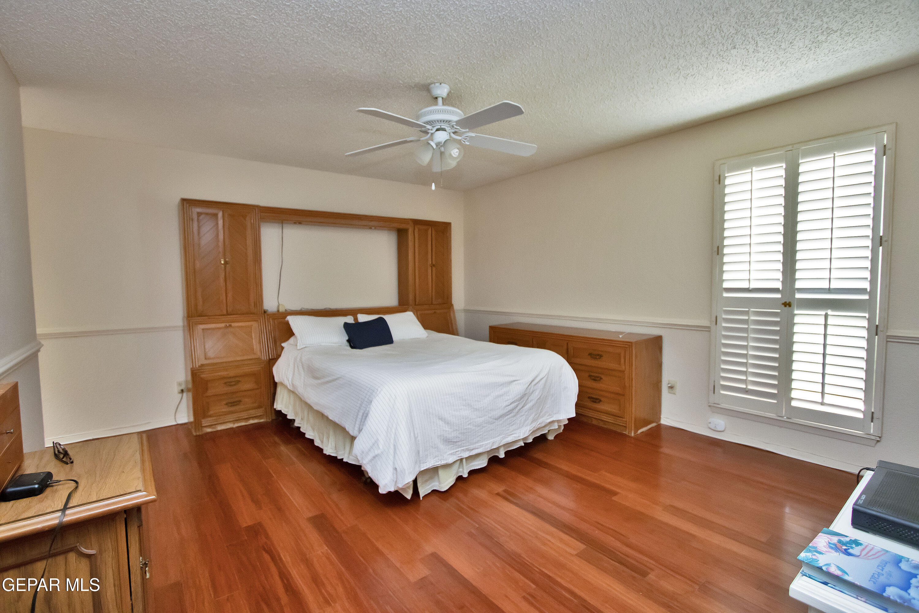 116 North Trevino Road Santa Teresa, NM 88008 - Photo 58 of 77 a bedroom with a bed and wooden floor