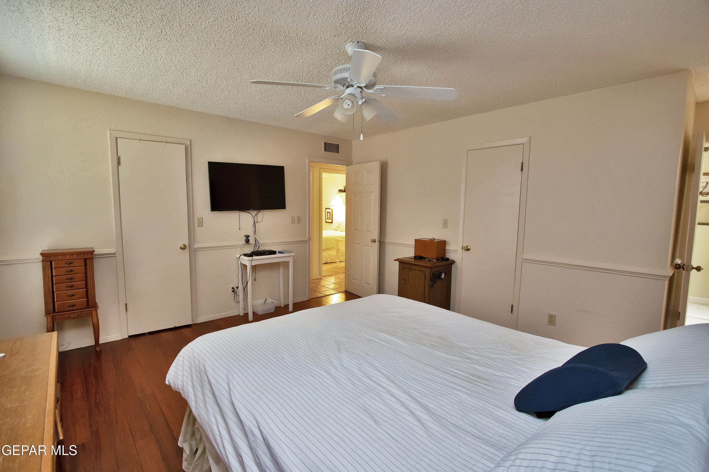 116 North Trevino Road Santa Teresa, NM 88008 - Photo 60 of 77 a bedroom with a bed and a flat screen tv