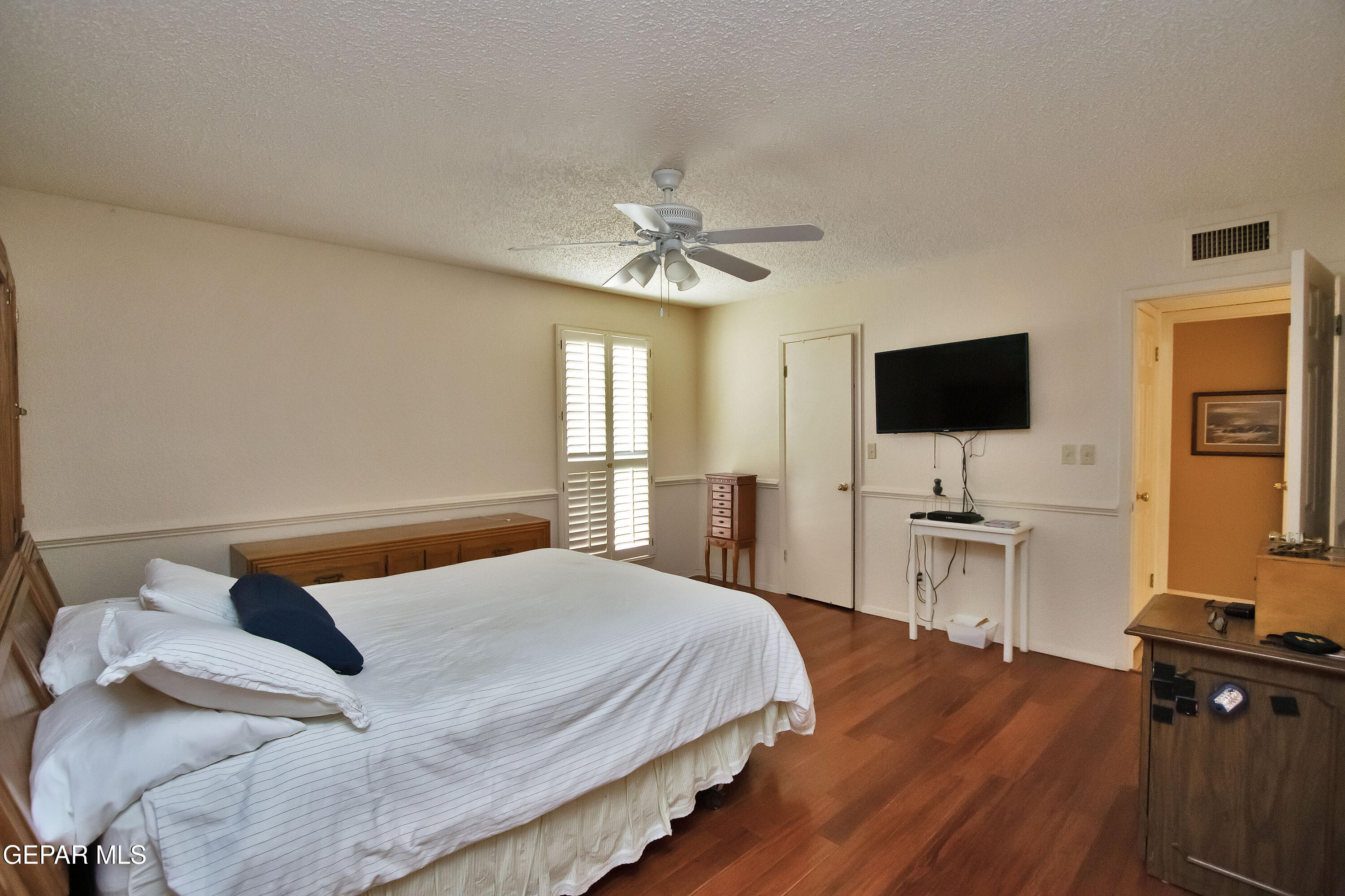 116 North Trevino Road Santa Teresa, NM 88008 - Photo 61 of 77 a bedroom with a bed and a flat screen tv