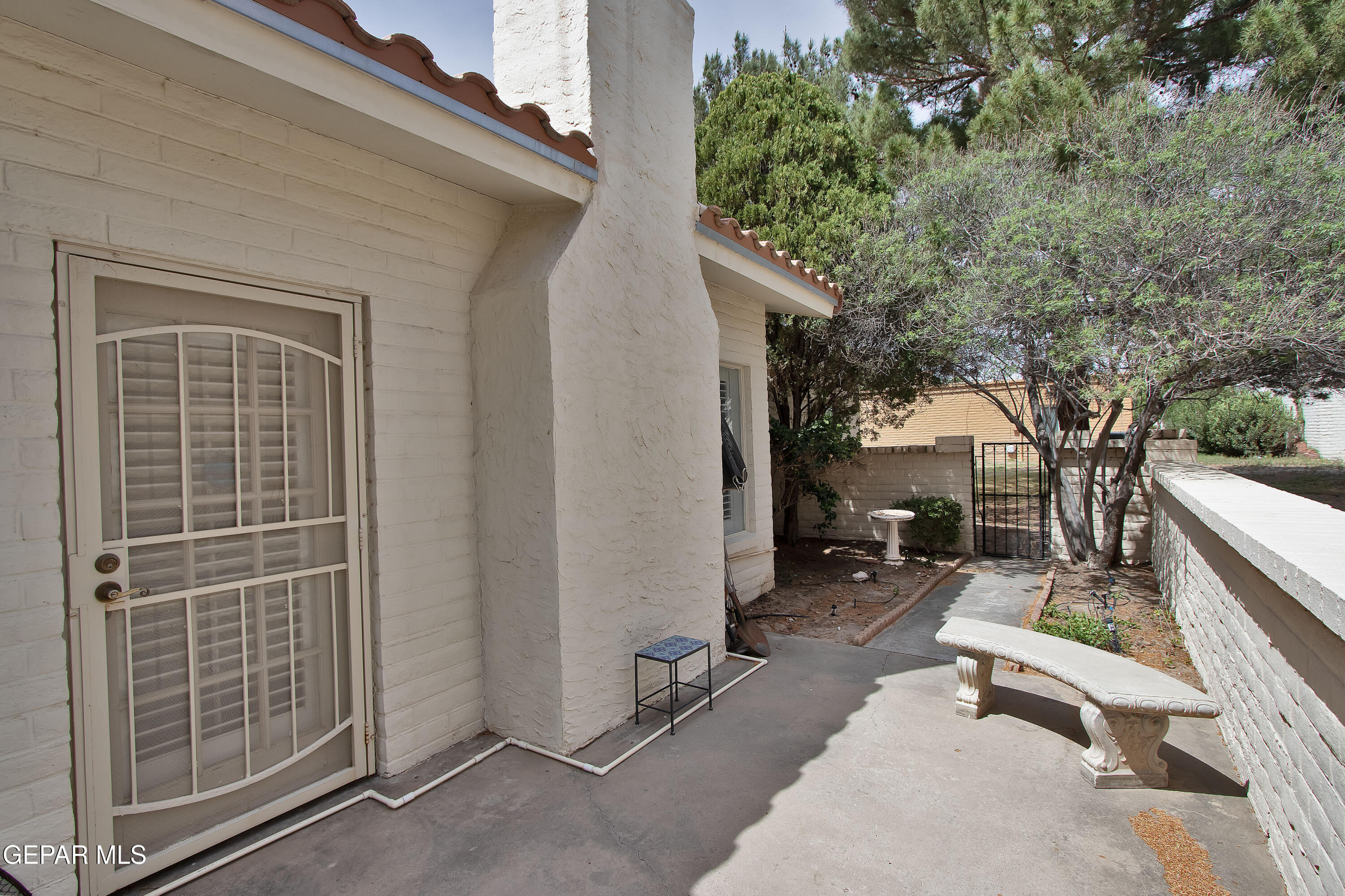 116 North Trevino Road Santa Teresa, NM 88008 - Photo 68 of 77 a backyard of a house with outdoor seating and trees