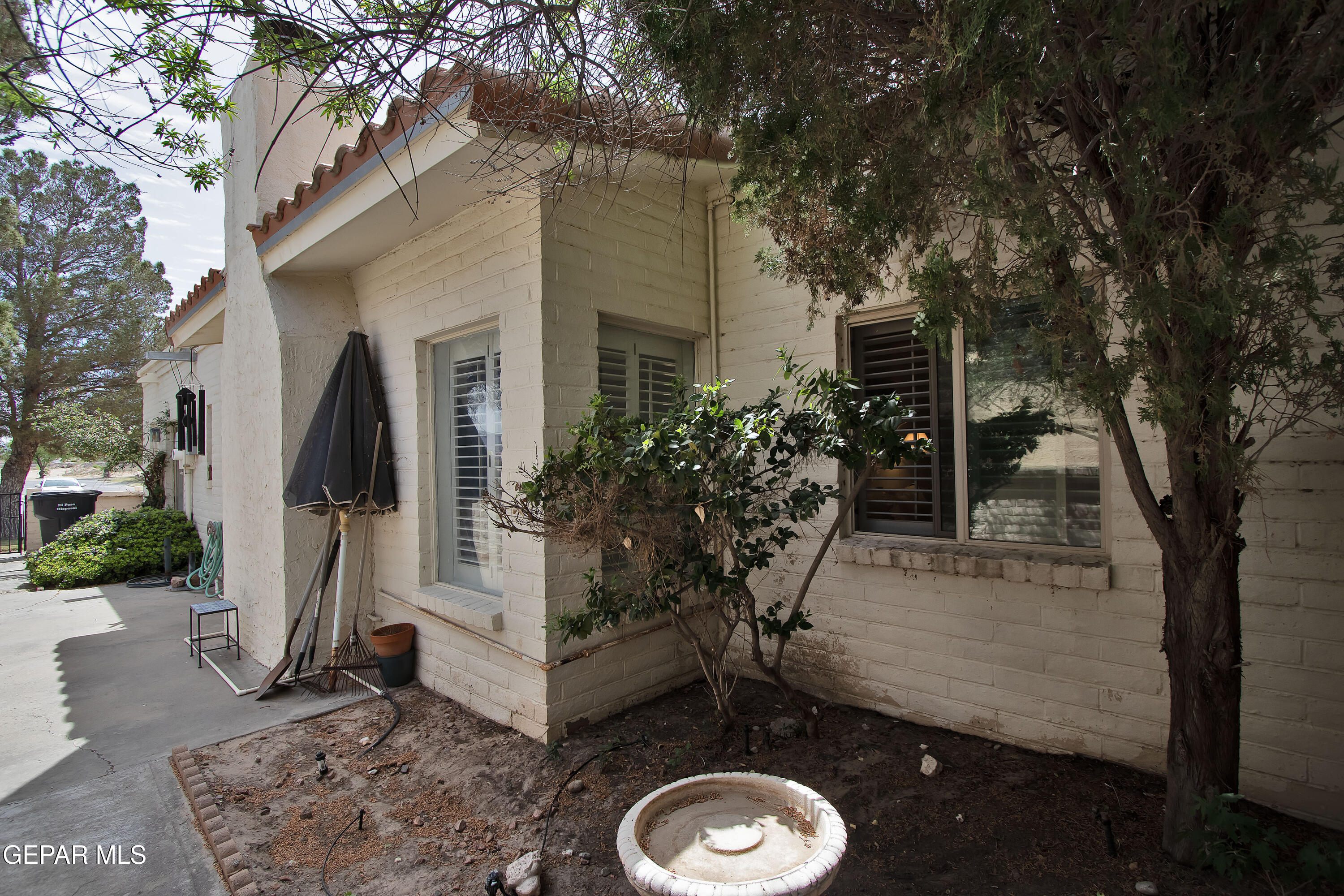 116 North Trevino Road Santa Teresa, NM 88008 - Photo 70 of 77 a backyard of a house with yard fountain and outdoor seating