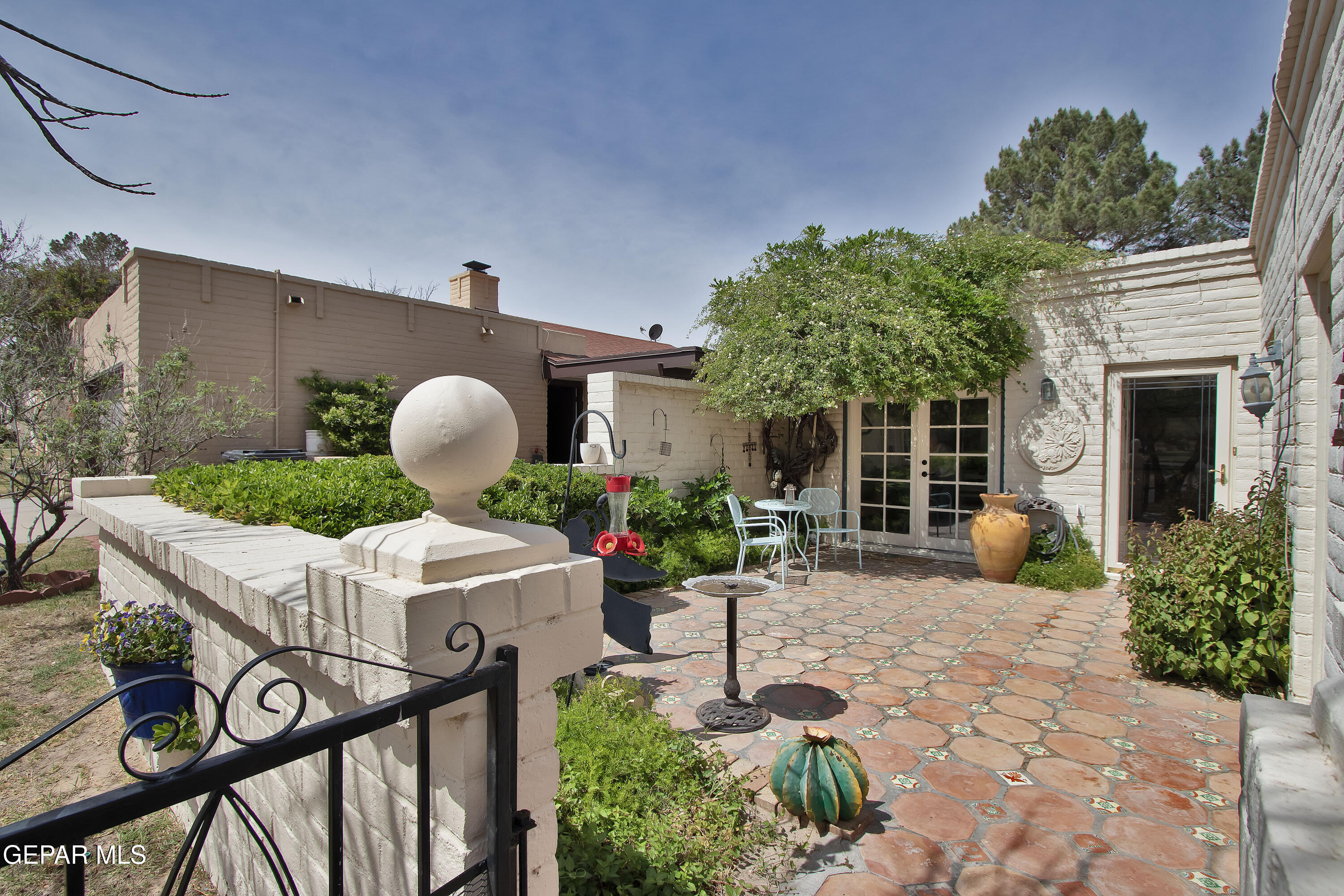 116 North Trevino Road Santa Teresa, NM 88008 - Photo 9 of 77 a front view of a house with garden and sitting area