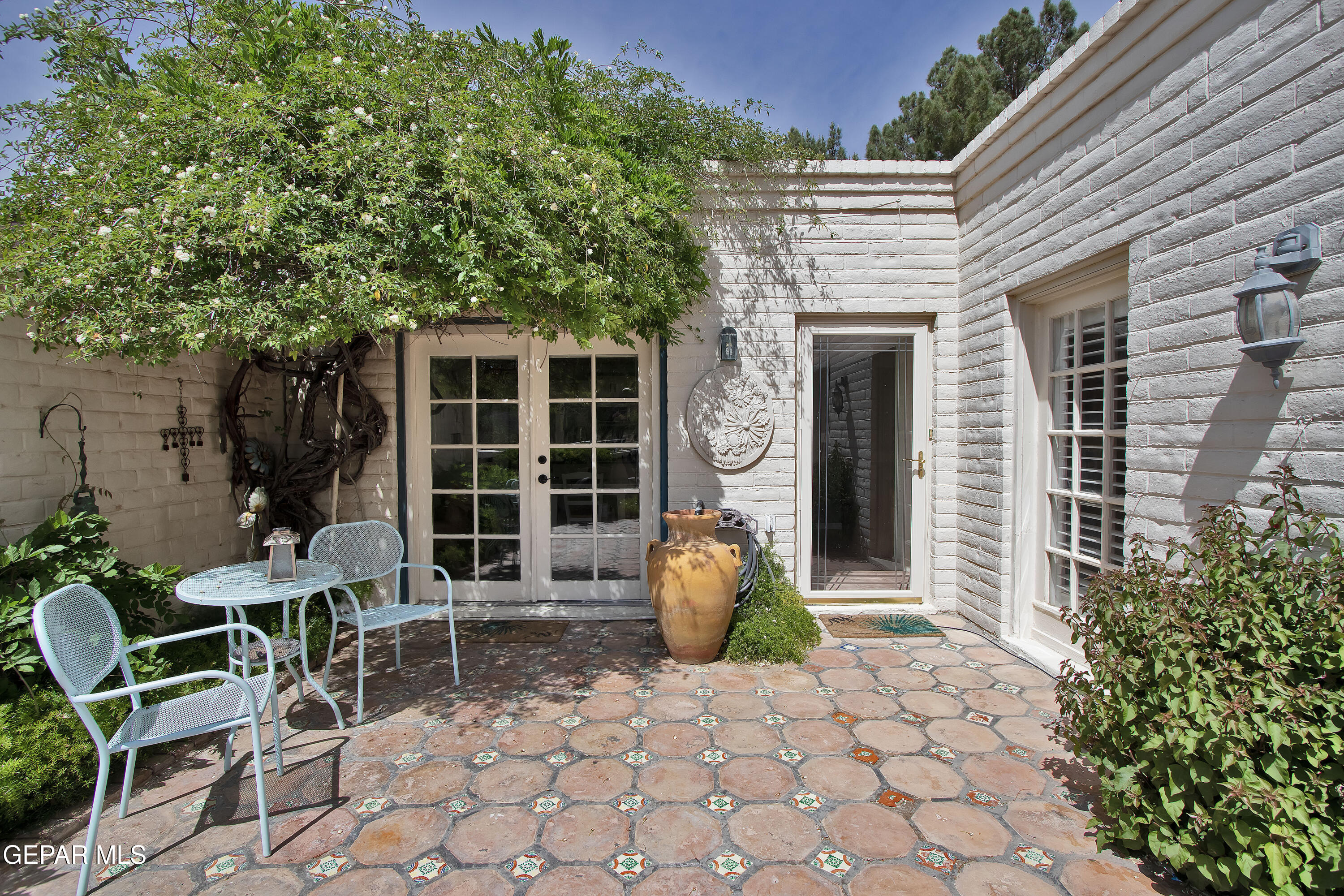 116 North Trevino Road Santa Teresa, NM 88008 - Photo 10 of 77 a view of a chair and table in backyard of the house