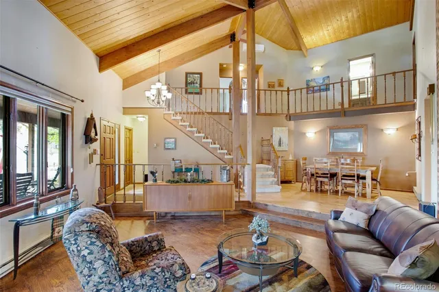 a kitchen with stainless steel appliances granite countertop sink refrigerator and microwave