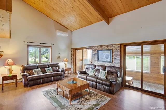 a bedroom with furniture and a chandelier