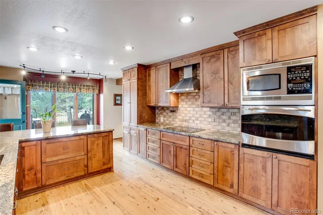 a bedroom with a bed and a dresser in it