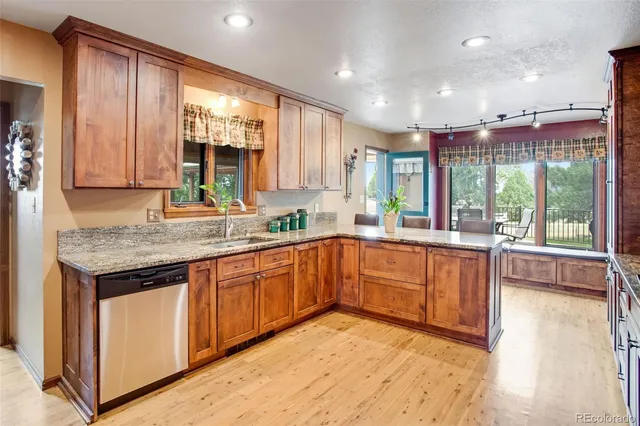 a bathroom with a sink shower and a mirror