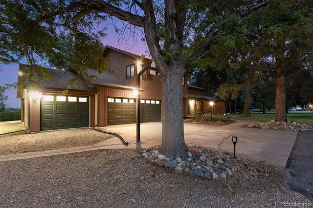 a view of a livingroom with furniture and floor to ceiling window