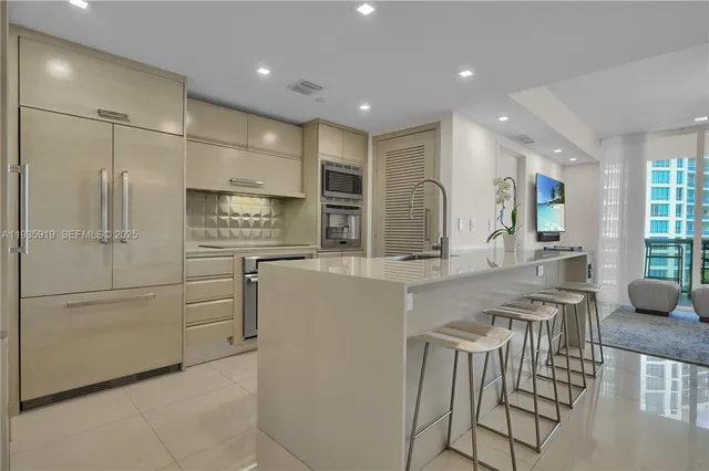 a kitchen with stainless steel appliances granite countertop a sink and cabinets