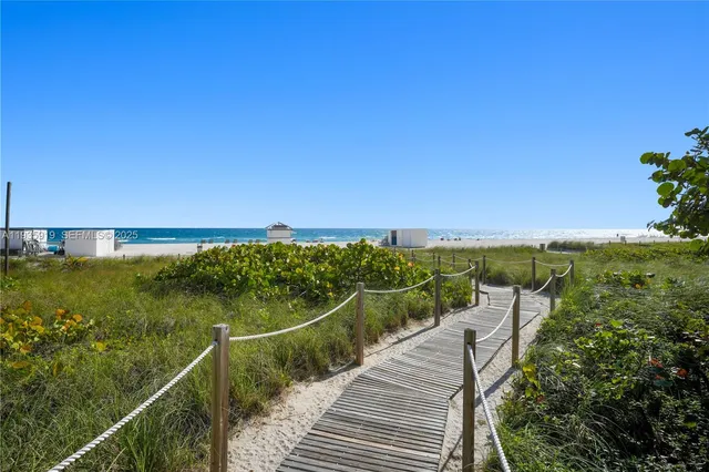 a view of a house with backyard sitting area and swimming pool