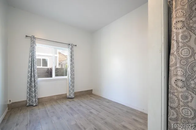 a view of hallway with wooden floor