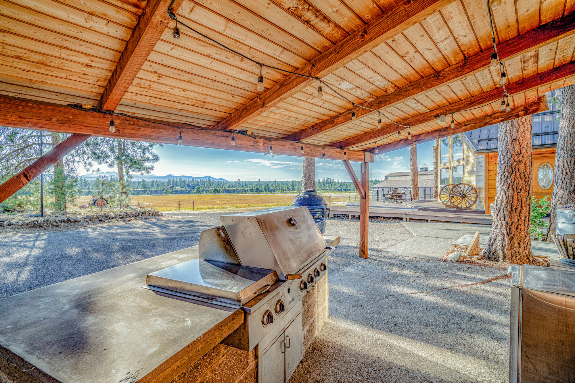 60647 Antler Road Bend, OR 97702 - Photo 32 of 44 a view of a patio with a table and chairs