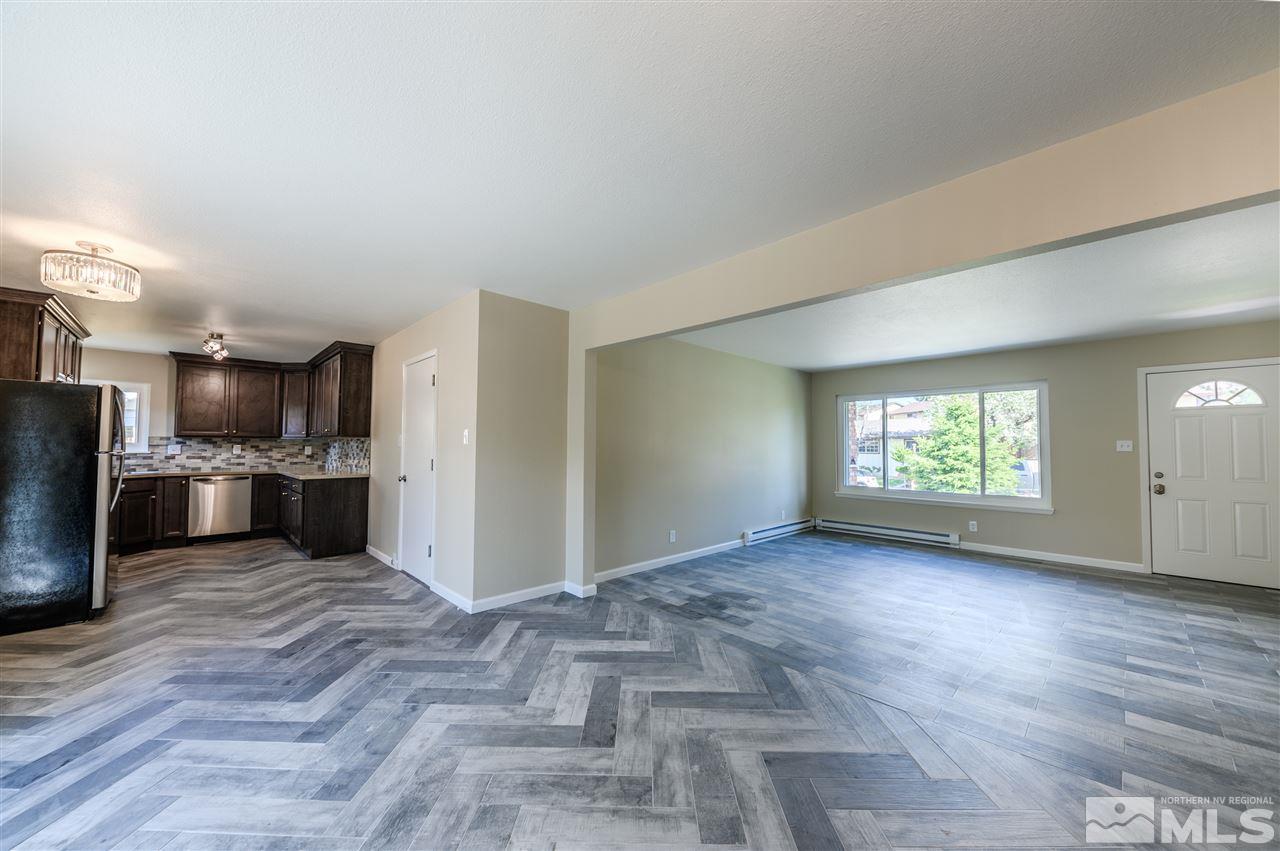 1575 Elizabeth Street Reno, NV 89509 - Photo 5 of 19 an empty room with wooden floor and windows