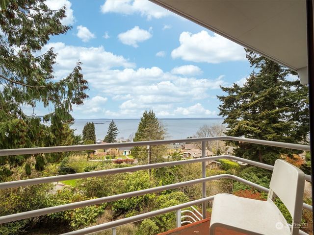 a view of a tennis court with a ceiling fan
