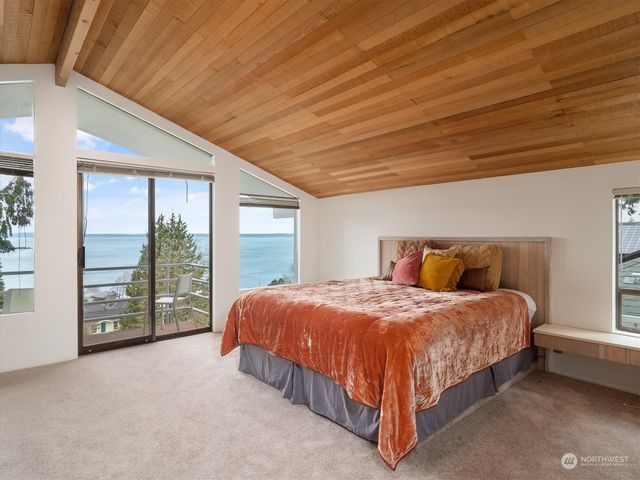 a bedroom with a bed and a cabinets