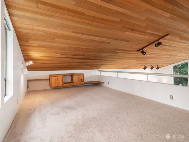 a view of an empty room with windows