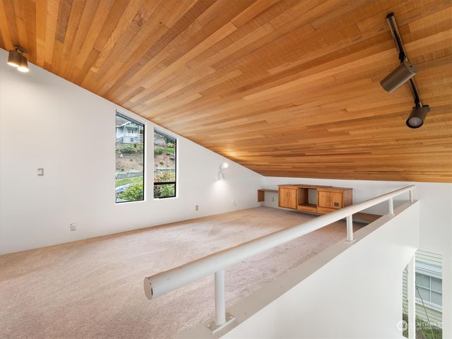a view of an empty room and a window