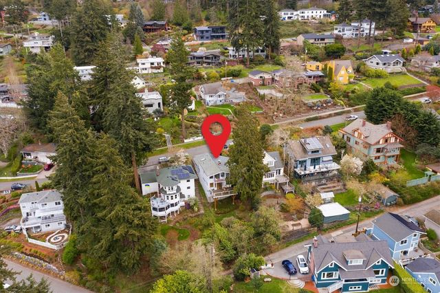 an aerial view of residential houses with outdoor space
