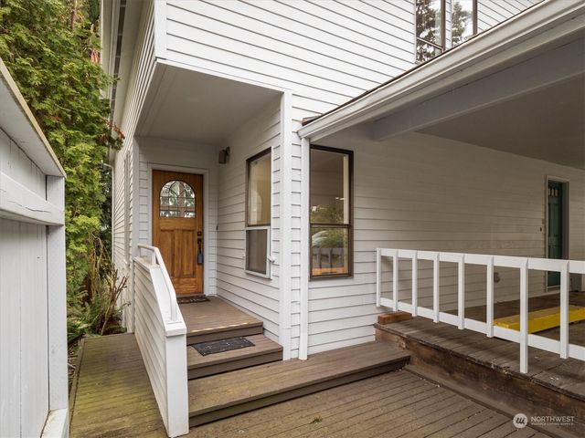 a view of a balcony with chairs