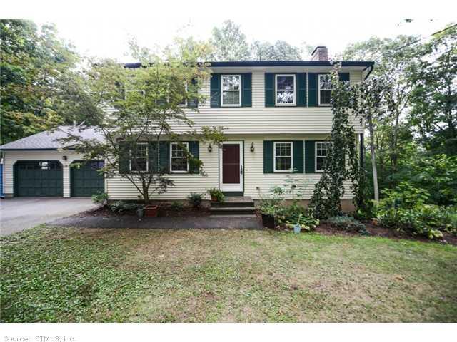 116 Sumner Wood Road Durham, CT 06422 - Photo 1 of 1 a view of a house with a yard and lawn chairs with a fire pit