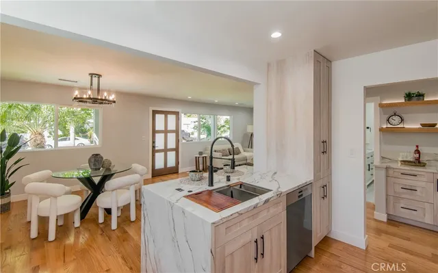 a kitchen that has a table and chairs in it