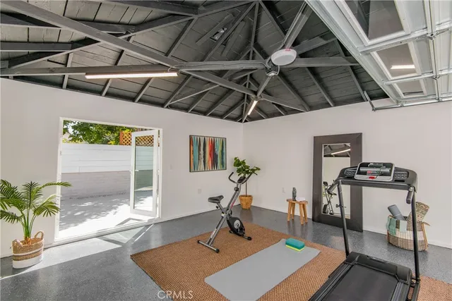 a living room with a couch and next to a window
