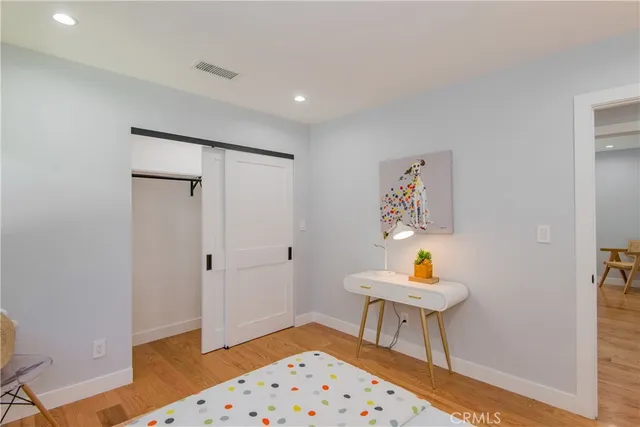 a workspace with furniture and wooden floor