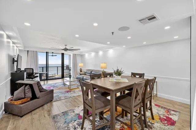 a view of a chairs and table in patio