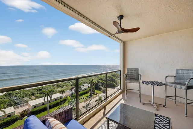 a living room with a couch and a large window
