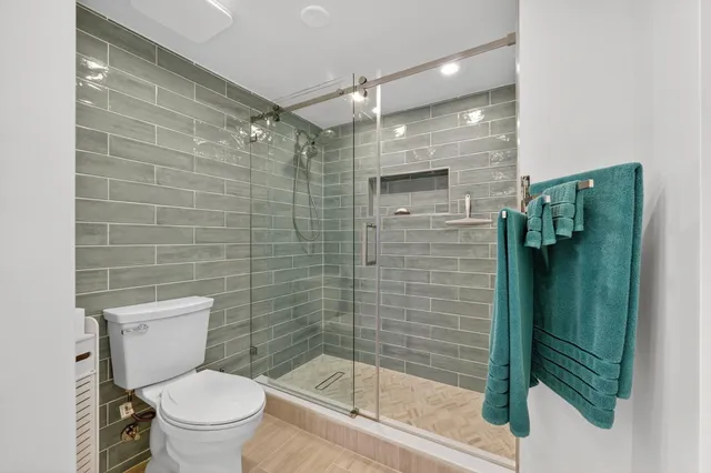 a view of room with stairs and wooden floor