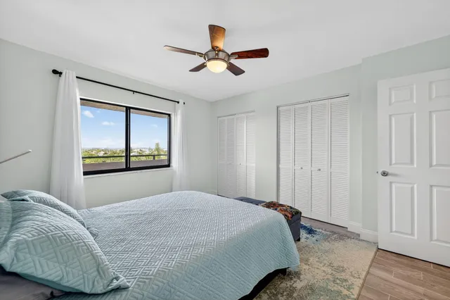 an aerial view of a city with ocean view in back