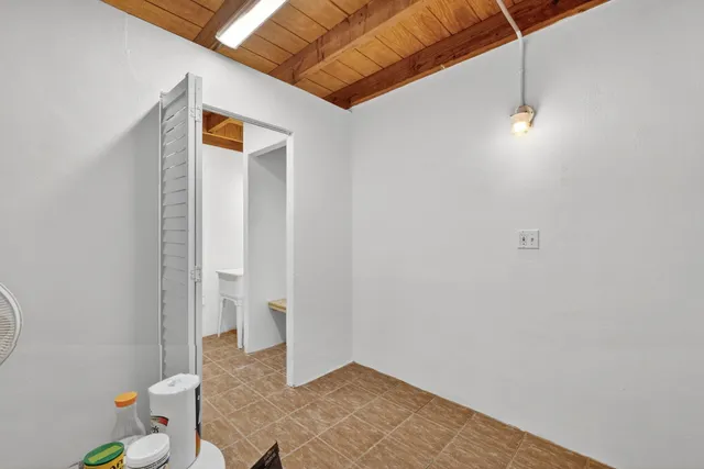 a view of swimming pool with a lounge chairs